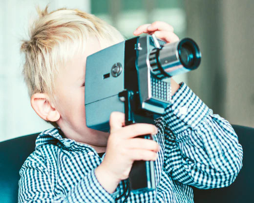 Close up of 8mm film projector changing the focus point between