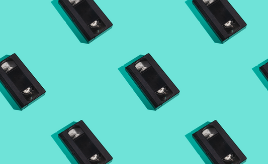 vhs tapes on a blue surface 