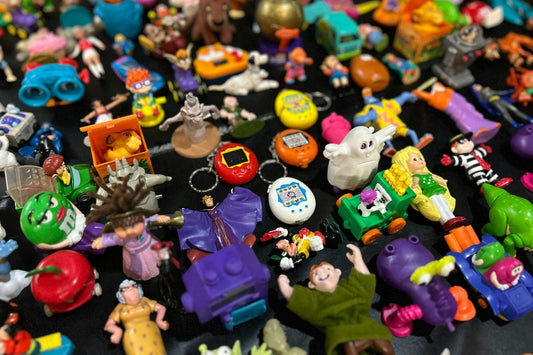 A pile of popular 90s toys showcasing the coolest and most famous 90s toys of the decade.