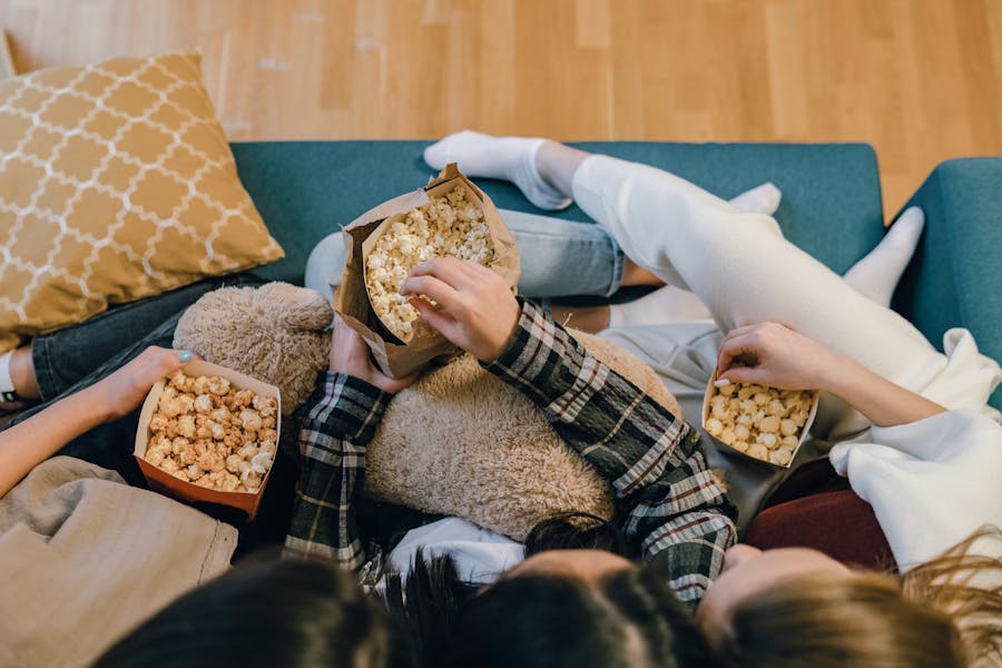 a group of people eating popcorn 