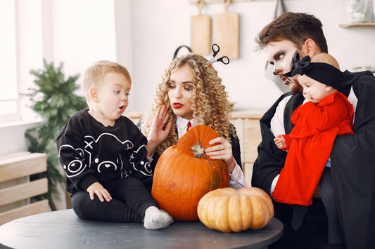 a family in Halloween costumes  