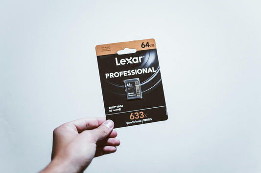 a person holding an SD card