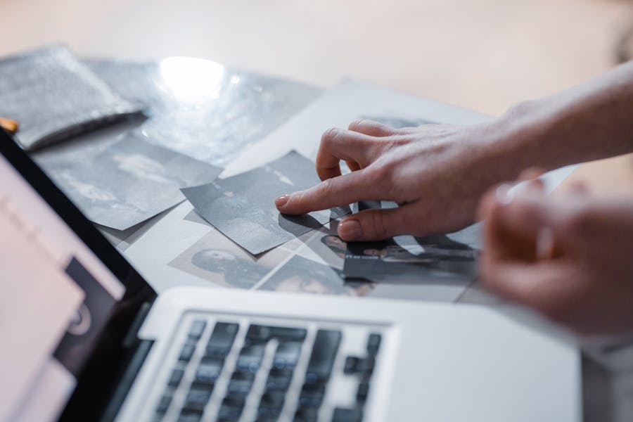 a person sorting through photos 
