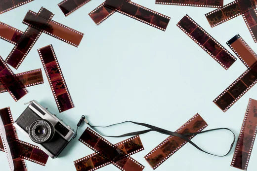 a camera surrounded with negatives 